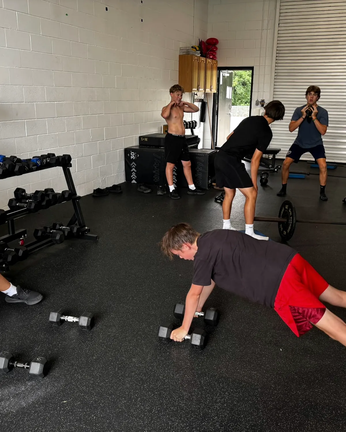 Athletes working through a floor circuit