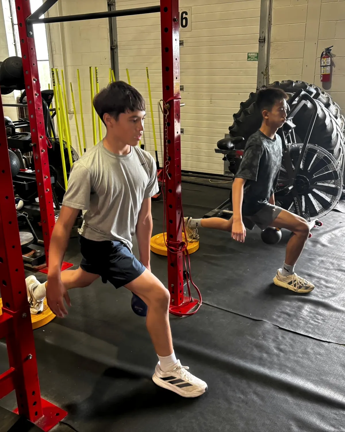 Young athletes training at the rack